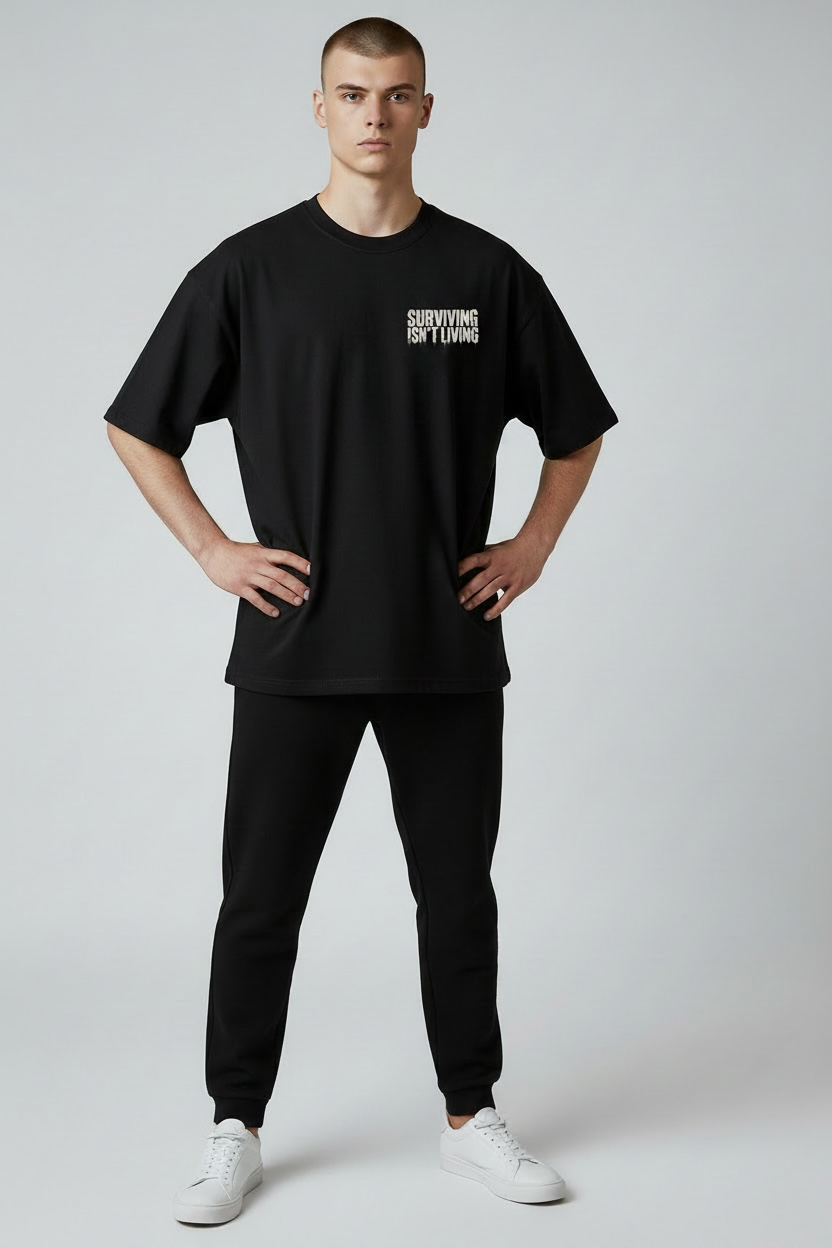 SURVIVING ISN'T LIVING – Oversized Tee